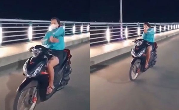 Cô gái đi xe máy thả 2 tay múa quạt ở Quảng Ngãi 